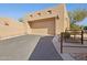 Attached, two-car garage with a private driveway and desert landscaping at 13013 N Panorama Dr # 120, Fountain Hills, AZ 85268