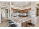 Kitchen with granite counters, tile backsplash, stainless steel appliances, and breakfast bar at 13013 N Panorama Dr # 120, Fountain Hills, AZ 85268
