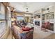 Comfortable living room with fireplace, built-in shelves, and sliding door to balcony at 13013 N Panorama Dr # 120, Fountain Hills, AZ 85268