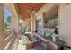 Comfortable patio with cushioned furniture, a ceiling fan, and desert views at 13013 N Panorama Dr # 120, Fountain Hills, AZ 85268