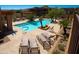 Community pool area with lounge chairs, palm trees, and a serene atmosphere at 13013 N Panorama Dr # 120, Fountain Hills, AZ 85268