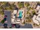 Aerial view of community pool and patio area with ample parking and lush landscaping at 13013 N Panorama Dr # 120, Fountain Hills, AZ 85268