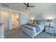 Bright bedroom with ceiling fan, ensuite bath, and soothing color scheme at 13455 N 142Nd Ave, Surprise, AZ 85379