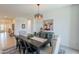Inviting dining room features dark wood table, upholstered chairs and colorful cow art on the wall at 13455 N 142Nd Ave, Surprise, AZ 85379