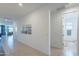 Bright hallway with tile flooring offers easy access to bedrooms, bathrooms, and a comfortable living space at 13455 N 142Nd Ave, Surprise, AZ 85379