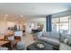 Open-concept living room features a neutral color palette and access to the outdoor patio at 13455 N 142Nd Ave, Surprise, AZ 85379