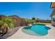 Backyard pool with a desert landscape providing an oasis for relaxation and recreation in the comfort of your own home at 13455 N 142Nd Ave, Surprise, AZ 85379