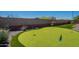 Landscaped putting green featuring artificial turf and desert plants providing a private area for practicing your short game at 13455 N 142Nd Ave, Surprise, AZ 85379