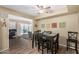 Cozy dining area with seating for six, and view of the backyard pool at 14212 N Newcastle Dr, Sun City, AZ 85351