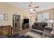 Inviting living room with comfortable furniture, wood-look flooring, and plenty of space at 14212 N Newcastle Dr, Sun City, AZ 85351