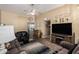 Bright living room with entertainment center, comfortable furniture, and open floor plan at 14212 N Newcastle Dr, Sun City, AZ 85351