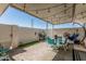Relaxing covered patio featuring string lights, outdoor furniture, and a hanging chair at 14212 N Newcastle Dr, Sun City, AZ 85351