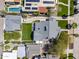 Aerial view showcasing property with lush backyard and pool, highlighting the desirable neighborhood setting at 144 W Palm Ln, Phoenix, AZ 85003