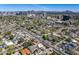 Scenic aerial view showcasing a vibrant city skyline with mountains in the distance overlooking a neighborhood at 144 W Palm Ln, Phoenix, AZ 85003