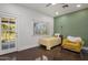Cozy bedroom featuring a single bed, chair, and ample natural light at 144 W Palm Ln, Phoenix, AZ 85003