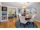 Cozy dining area with hardwood floors, stylish lighting, and views into living room at 144 W Palm Ln, Phoenix, AZ 85003