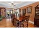 Spacious dining room with long wooden table and seating for multiple guests at 144 W Palm Ln, Phoenix, AZ 85003