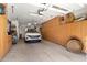 Spacious garage with ample storage cabinets and a parked car at 144 W Palm Ln, Phoenix, AZ 85003
