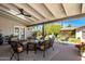 Inviting patio with cozy seating around a stone fire pit at 144 W Palm Ln, Phoenix, AZ 85003
