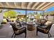 Inviting patio with cozy seating around a stone fire pit at 144 W Palm Ln, Phoenix, AZ 85003