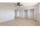 Spacious, light-filled bedroom with new flooring, a ceiling fan, and a large closet at 14803 N 55Th Ave, Glendale, AZ 85306