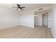 Bright, minimalist bedroom with a ceiling fan, recessed lighting, and sleek flooring at 14803 N 55Th Ave, Glendale, AZ 85306