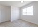 A bedroom features a large closet with doors and a window to bring in plenty of sunlight at 14803 N 55Th Ave, Glendale, AZ 85306