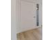 Close-up of the freshly painted white front door with a side light window at 14803 N 55Th Ave, Glendale, AZ 85306