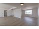 Bright, airy living room with wood floors and a large window at 14803 N 55Th Ave, Glendale, AZ 85306