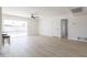 Bright living room featuring a ceiling fan and sliding door to a pool at 14803 N 55Th Ave, Glendale, AZ 85306