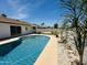 Backyard swimming pool with mature landscaping and ample space for lounging at 14803 N 55Th Ave, Glendale, AZ 85306