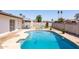 Inviting backyard pool with lounge chairs, surrounded by a well-maintained patio and block fencing for added privacy at 14803 N 55Th Ave, Glendale, AZ 85306