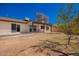 Backyard features a covered patio, desert landscaping, and a well-maintained yard at 15022 N 22Nd Ln, Phoenix, AZ 85023