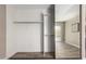 Open closet showing shelving and a view through the sliding door to the outside at 15022 N 22Nd Ln, Phoenix, AZ 85023
