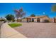 Attractive single-story home with desert landscaping, a two-car garage, and a well-maintained lawn at 15022 N 22Nd Ln, Phoenix, AZ 85023