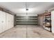 An organized garage provides storage cabinets, shelving, and ample workspace at 15022 N 22Nd Ln, Phoenix, AZ 85023