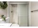 Clean bathroom showing the tile shower with sliding glass doors at 15022 N 22Nd Ln, Phoenix, AZ 85023