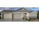 Charming single-Gathering home with a three-car garage and a welcoming entrance at 16753 W Whispering Wind Dr, Surprise, AZ 85387