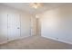 Neutral bedroom with carpet and ample closet space creates a comfortable and versatile living area at 18123 W Lundberg St, Surprise, AZ 85388