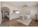 Elegant dining area features an open layout with modern lighting and a glass table setting at 18123 W Lundberg St, Surprise, AZ 85388