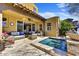 Inviting backyard with a plunge pool, comfortable seating, covered patio, and easy access to indoor living spaces at 18572 N 94Th St, Scottsdale, AZ 85255