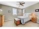 Comfortable bedroom with soft carpet, natural light, and a wood dresser at 18572 N 94Th St, Scottsdale, AZ 85255