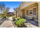 Inviting front porch features comfortable seating, perfect for relaxing and enjoying the neighborhood at 18572 N 94Th St, Scottsdale, AZ 85255