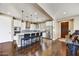 Modern kitchen features stainless steel appliances, granite countertops and a spacious island with bar stool seating at 18572 N 94Th St, Scottsdale, AZ 85255