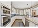 Well-equipped kitchen boasts stainless steel appliances, granite countertops, and ample cabinet space at 18572 N 94Th St, Scottsdale, AZ 85255