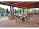 Poolside patio with tables, chairs, and lounge chairs for residents to relax by the pool at 18572 N 94Th St, Scottsdale, AZ 85255