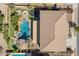 Aerial view showcases a private backyard oasis with a sparkling pool and putting green at 21256 E Waverly Dr, Queen Creek, AZ 85142