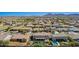 Neighborhood view showcases a home with a pool, spa, covered patio, and a putting green at 21256 E Waverly Dr, Queen Creek, AZ 85142
