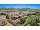 Expansive backyard offers a pool, putting green, covered patio, and lush landscaping at 21256 E Waverly Dr, Queen Creek, AZ 85142