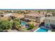 Private backyard features a pool, spa, covered patio, and mature landscaping at 21256 E Waverly Dr, Queen Creek, AZ 85142